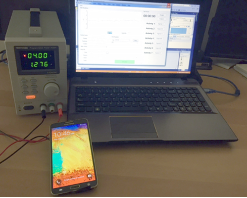 Power measurement system displayed on laptop, while connected to mobile phone to measure battery drain