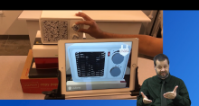 Screenshot of demo video showing the tangible augmented reality design tool and an ASL interpreter.